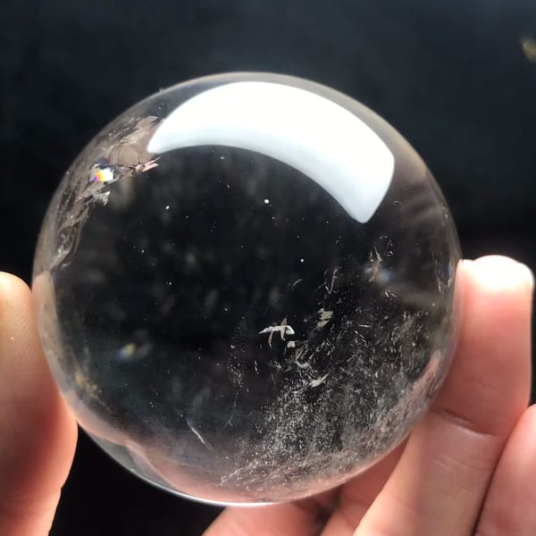 Clear sphere with a few wispy veils near its left edge