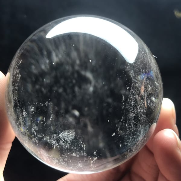 Streaks of reflected light radiating through the water-clear ball