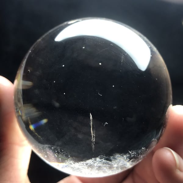 Thin needle-like streak and frosty base in the clear quartz
