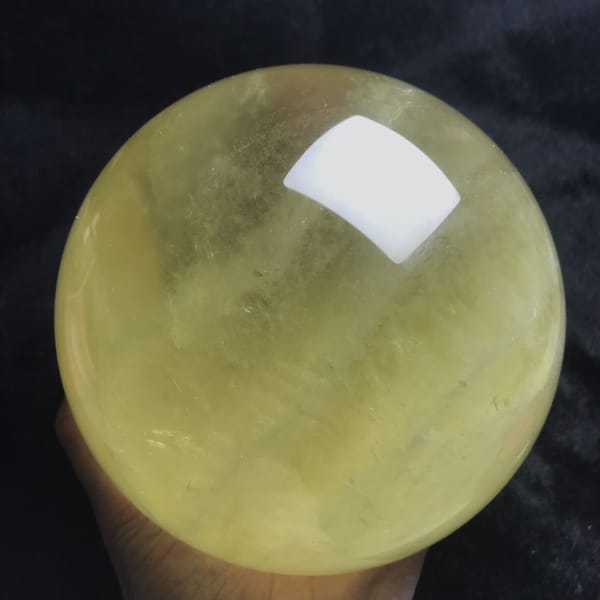 Lower edge of the citrine sphere showing layered veils