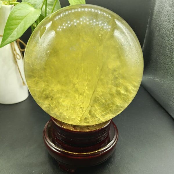 Paler side of the citrine sphere with soft cloudy inclusions