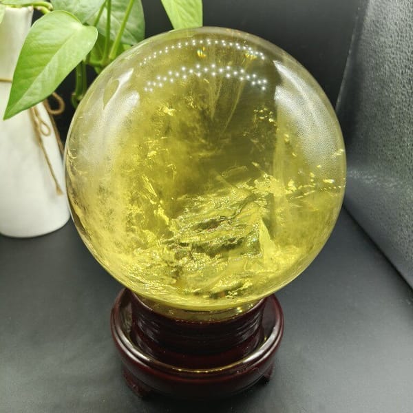 Citrine sphere on stand showing sparkling inner layers