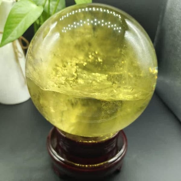 Horizontal plane of inclusions across the large yellow sphere