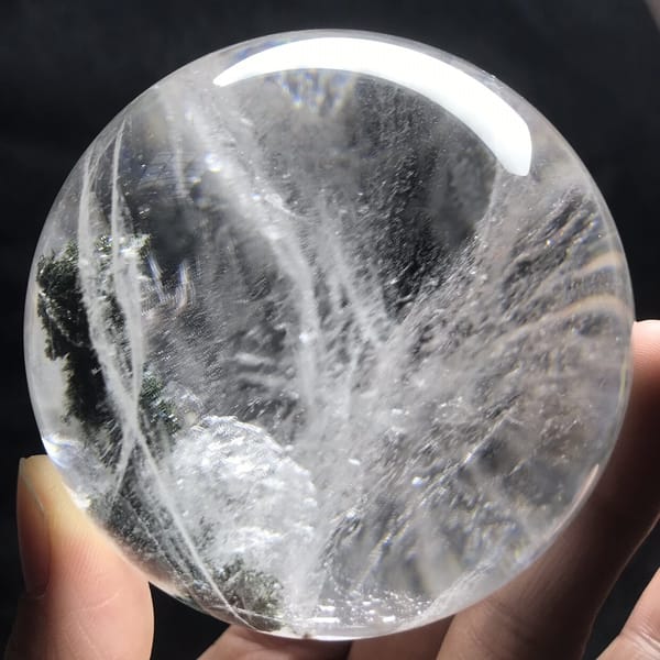 White feather veils and a rounded frosted area inside the sphere