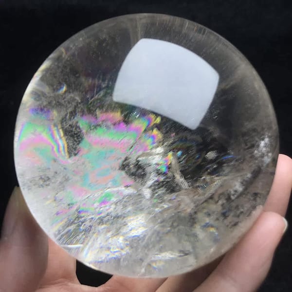 Soft rainbow spread through veils on another face of the sphere