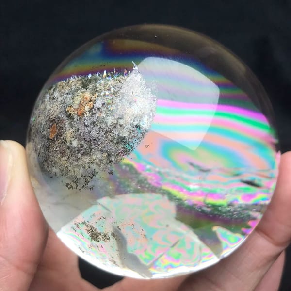 Orange-speckled garden cluster beside a rainbow inside the quartz