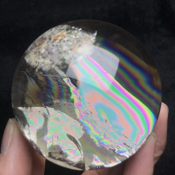 Rainbow sweeping diagonally across frosted phantoms in the ball
