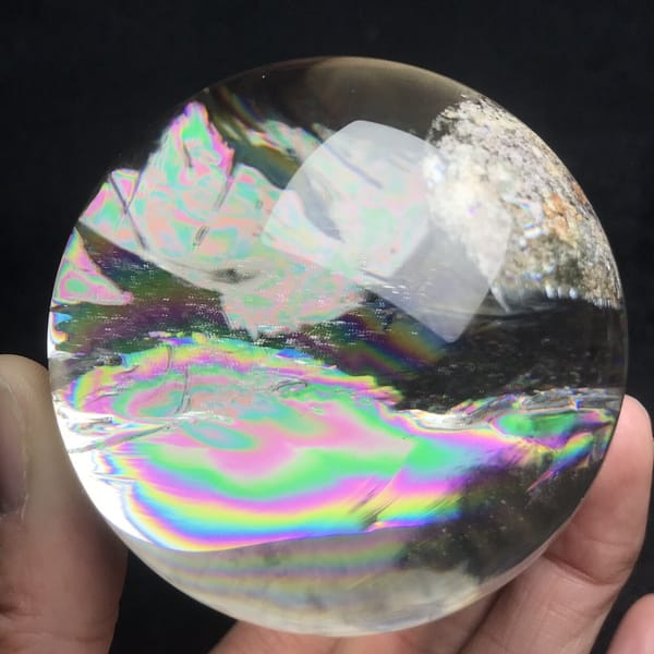 Rainbow rings and white phantom sheets seen from the front