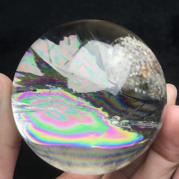 Concentric rainbow bands in the lower half of the sphere