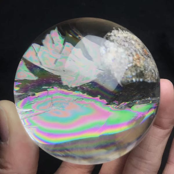 Rainbow and frosted phantoms layered across the polished ball