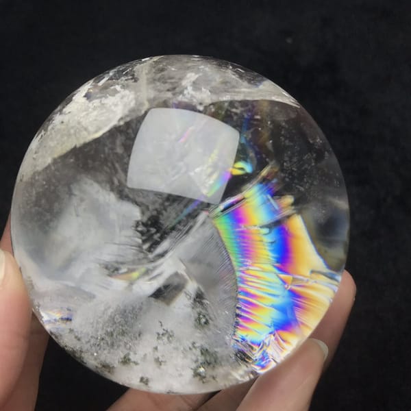 Rainbow arc and green speckled phantom in the lower sphere