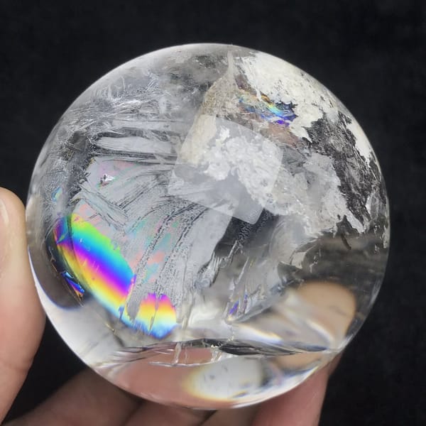 Rainbow near the bottom edge and frosty white phantom sheets