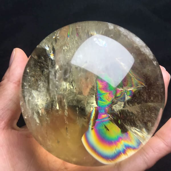 Champagne citrine sphere with a large hourglass-shaped rainbow