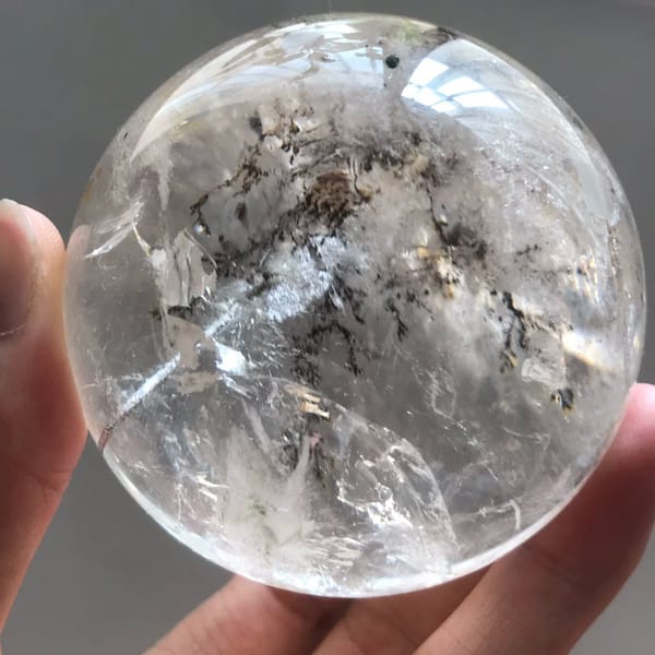 Branching dark inclusions and white veils from a side angle of the ball