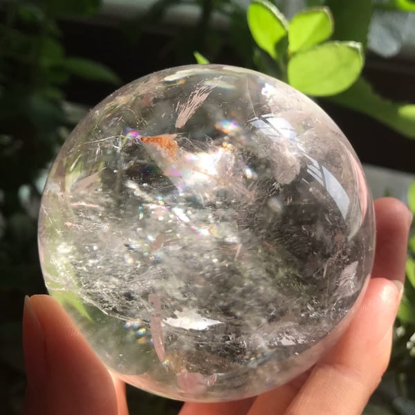 Sparkling white veils and a small rainbow inside the enhydro sphere