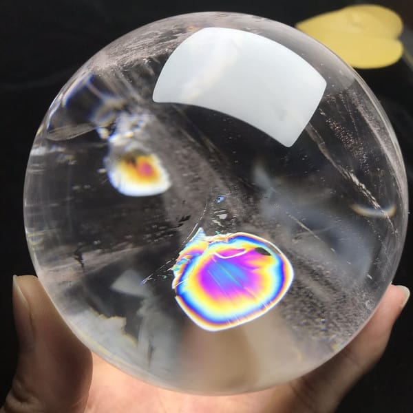 Round rainbow and small gold disc from a slightly turned angle