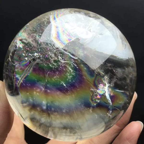 Rainbow band and speckled white clouds seen from a lower angle