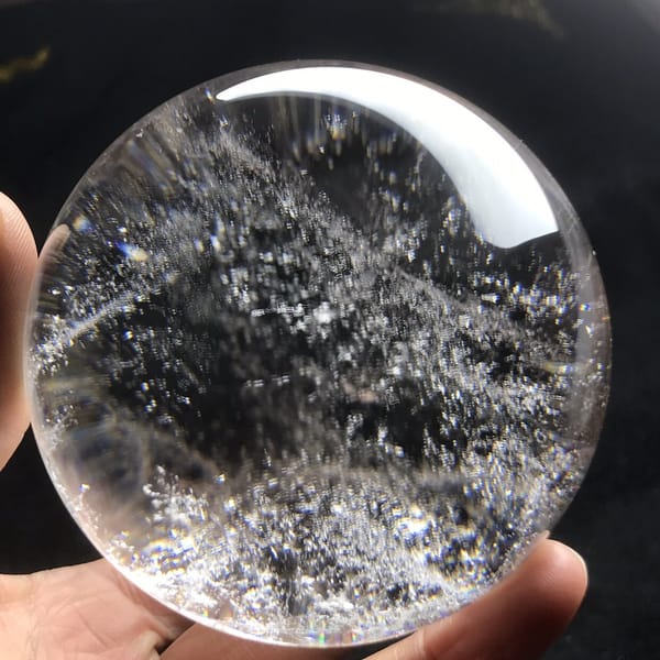 Diagonal sparkling bands crossing the quartz against black