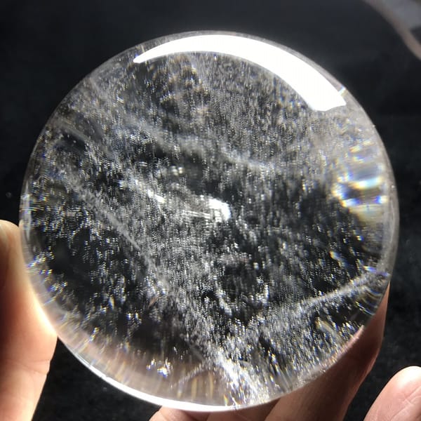 Crossing white veil lines and scattered specks in the sphere