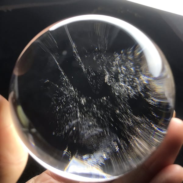 Speckled blue-grey clouds filling the right side of the sphere