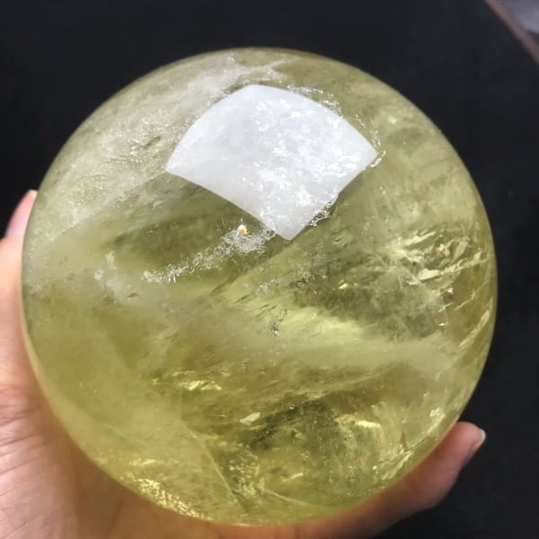 Glassy healed planes and soft veils inside the large citrine