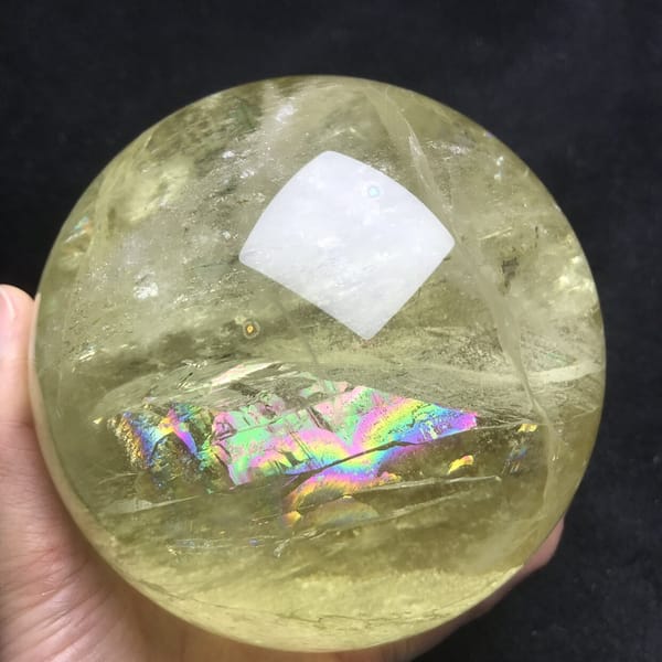 Horizontal rainbow glowing beneath the clear yellow quartz surface