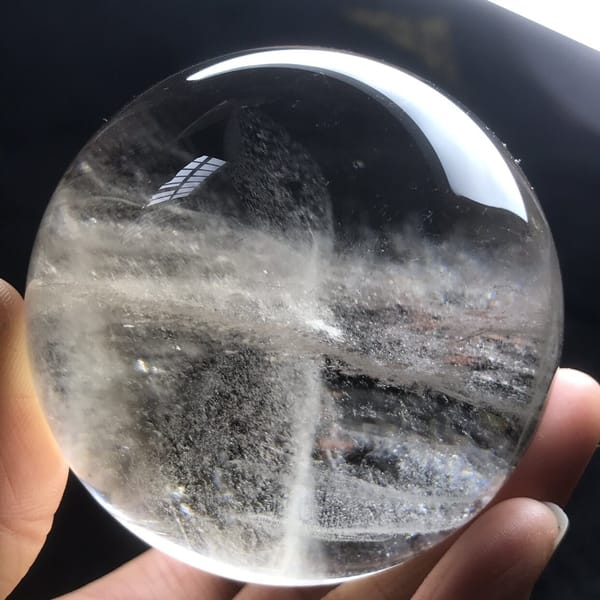 Layered misty bands seen through the light smoky quartz