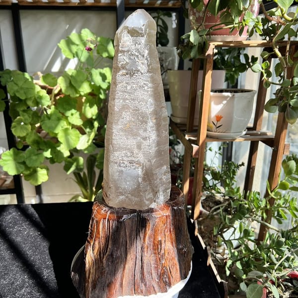 Stepped growth ridges along the quartz crystal shown on its stand