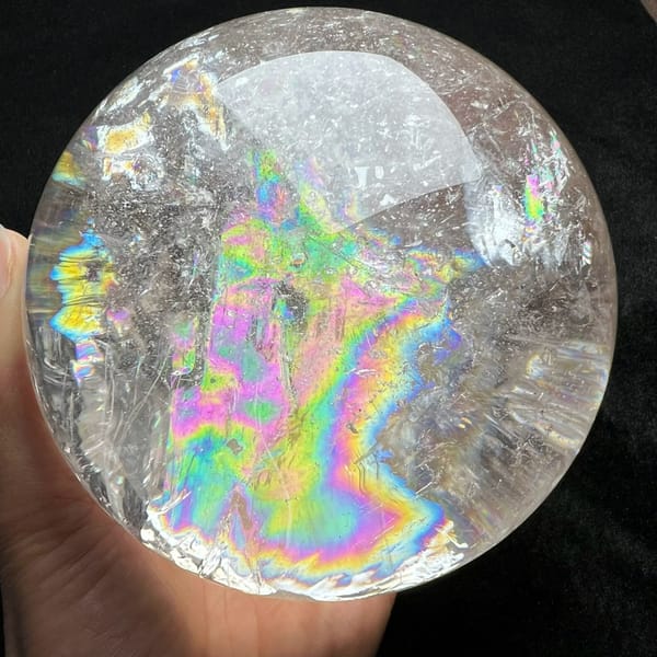 Bold multicoloured rainbow bands beside glittering internal crackle