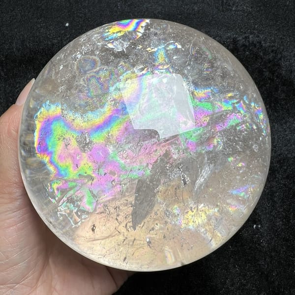 Sideways rainbow band with a glassy window above it