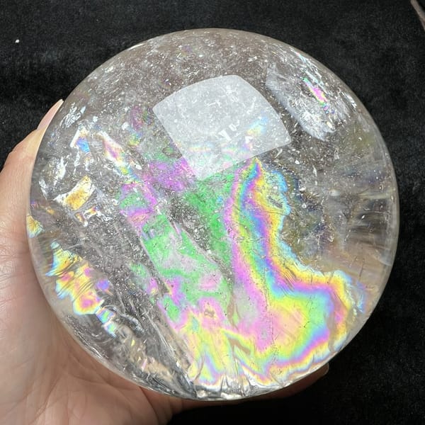 Rainbow curving into a hook shape in the right side of the sphere