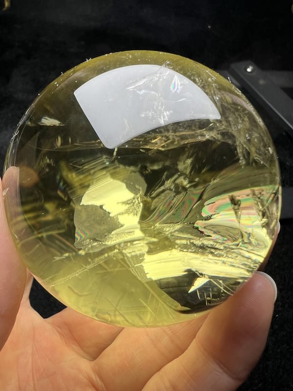 Repeat view of the citrine with deep veils below the reflection