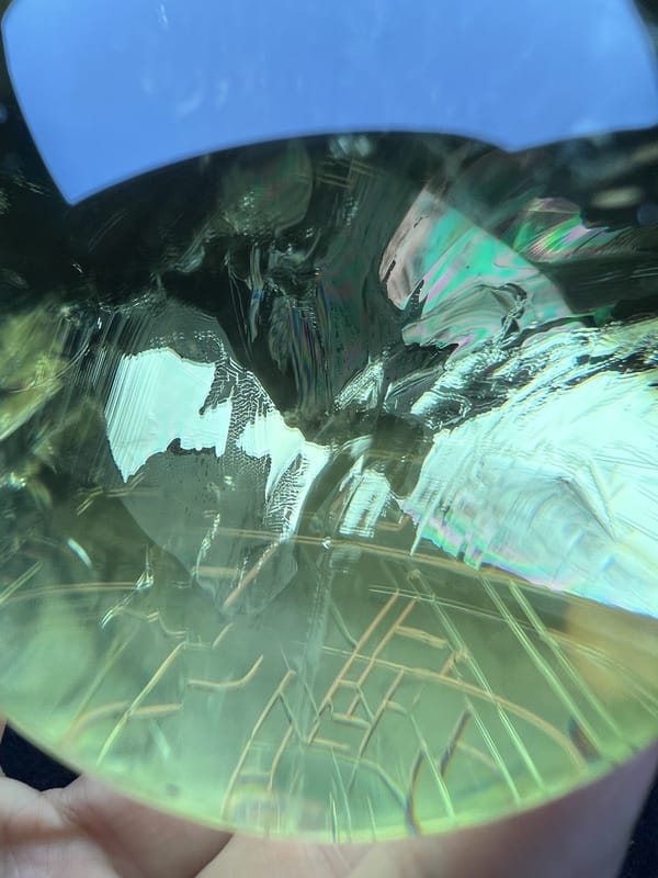 Close-up of greenish lemon citrine showing script-like inclusion lines