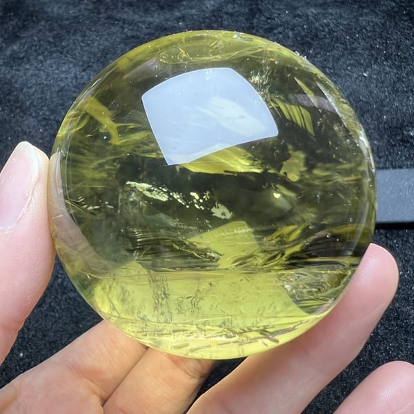 Citrine turned to show wispy veils and a clear lower zone