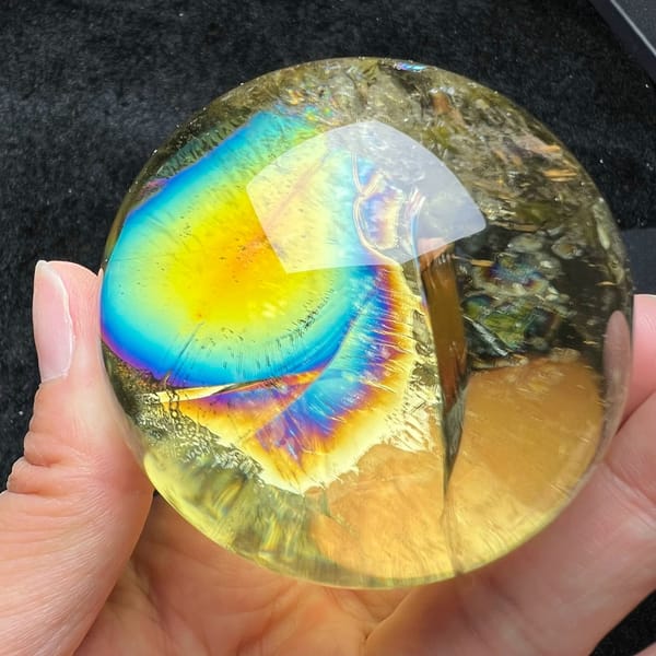 Wide yellow and blue rainbow fan beside a straight internal plane