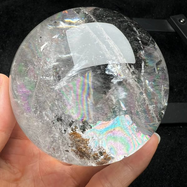 Pastel rainbow above a golden-brown phantom patch in the clear sphere