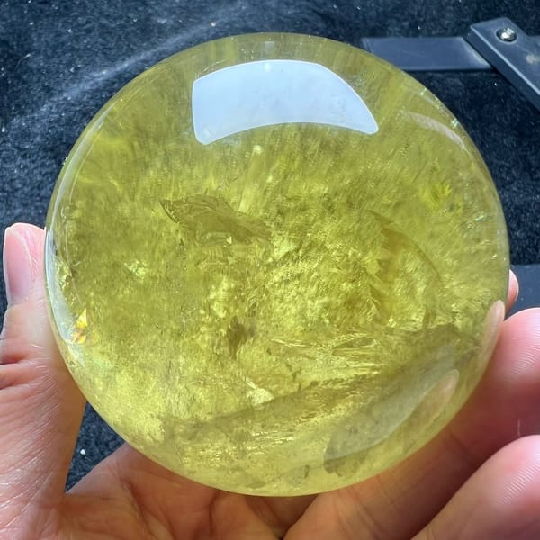 Citrine sphere showing layered veils like a bowl filling with light