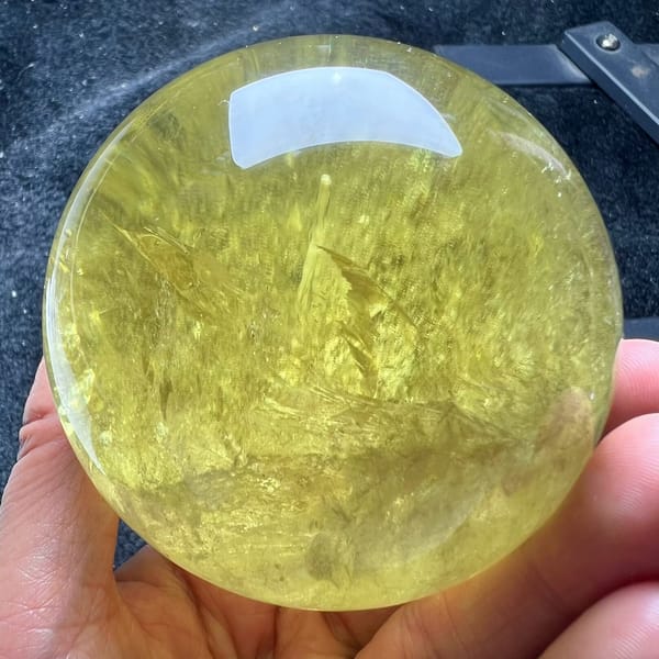 Feathered inclusions rising through the clear lemon citrine