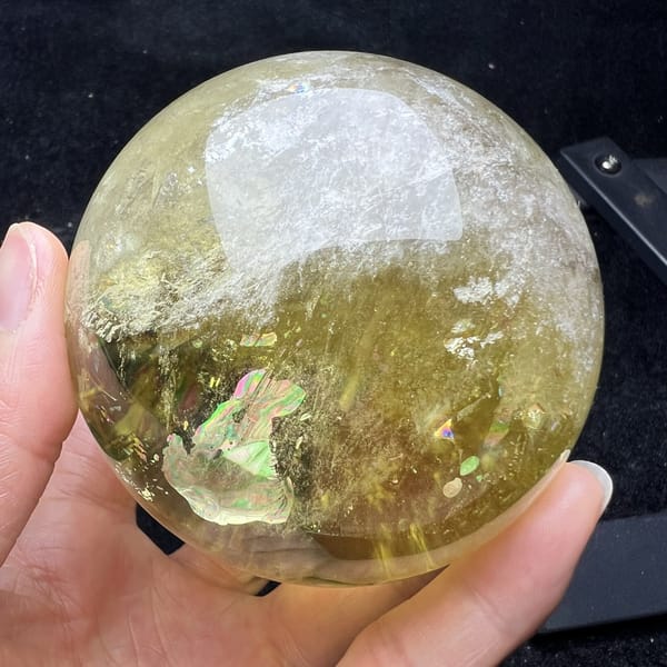 White stone-in-stone rod with a rainbow flash inside the citrine