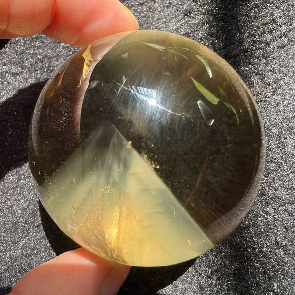 Warm golden citrine with a crisp pyramid outline on the lower half