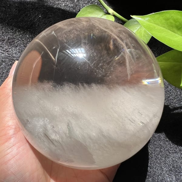 Fluffy cloud fringe glowing under the clear quartz dome