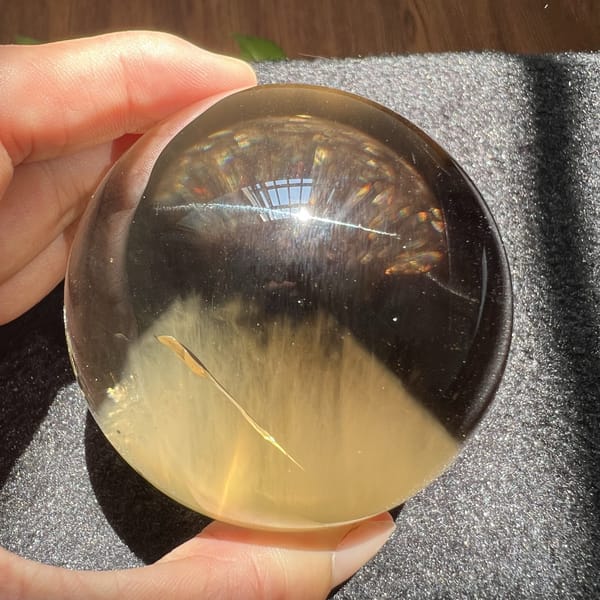 Single golden needle crossing the white mountain in the citrine