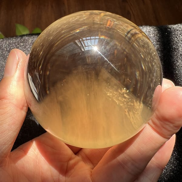 Golden backlit citrine with the soft white mountain inclusion