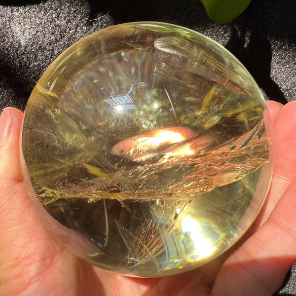 Golden veil band seen through clear citrine with a warm glow inside