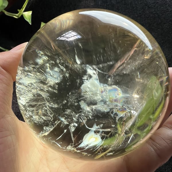 Other side of the citrine with white frosty clouds and a rainbow