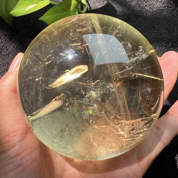 Feathered streak and needle-like lines inside the clear citrine