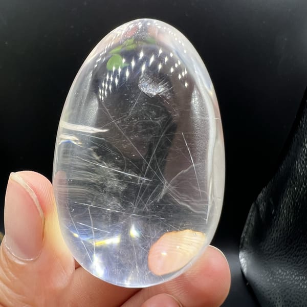 Side view of the egg with horizontal needles and a tiny feather
