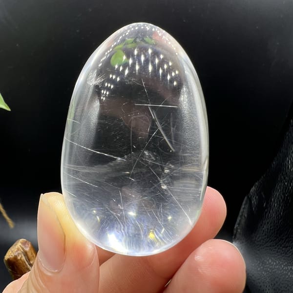 Narrow end of the polished egg showing clear quartz and fine rutile