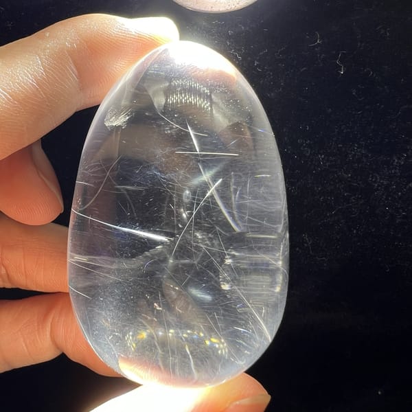 Backlit egg revealing needles and soft blue light at its centre
