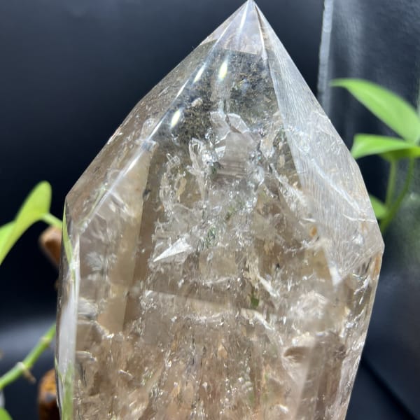 Close view of the tip and glittering inclusions inside the quartz